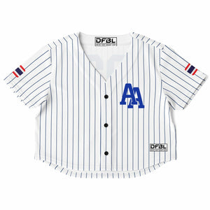 A white short-sleeve baseball-style crop top with thin navy vertical pinstripes, a blue 'AA' logo on the chest, and small red and navy sleeve accents. The brand name DF3L is visible on the inner neck label and lower right hem patch.